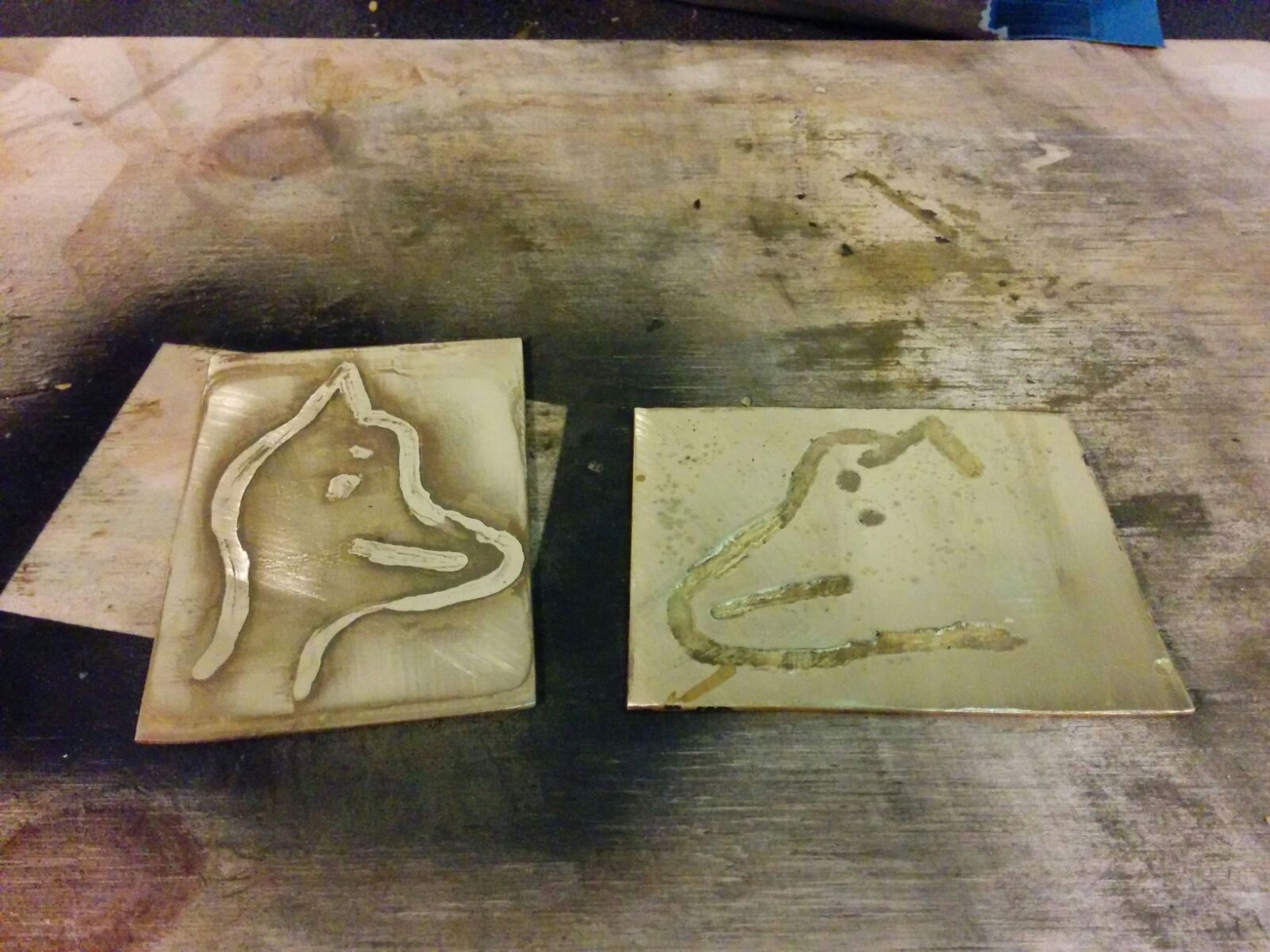 The two pieces after etching. The etch depth is about 0.1mm for both. Note that there is not a lot of contrast between the etched and unetched regions, and this became worse after a thorough clean