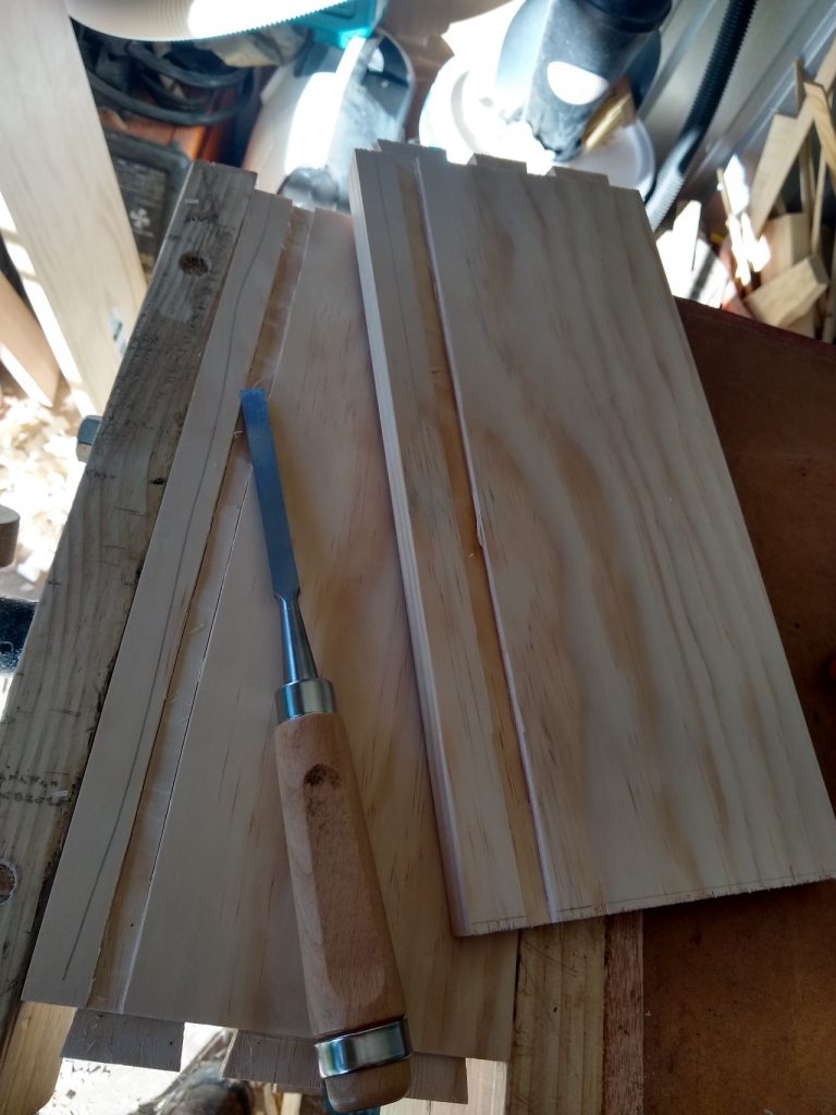 Cutting a recess for the base to sit in. I don't have a plough plane, so this was done by hand with a chisel