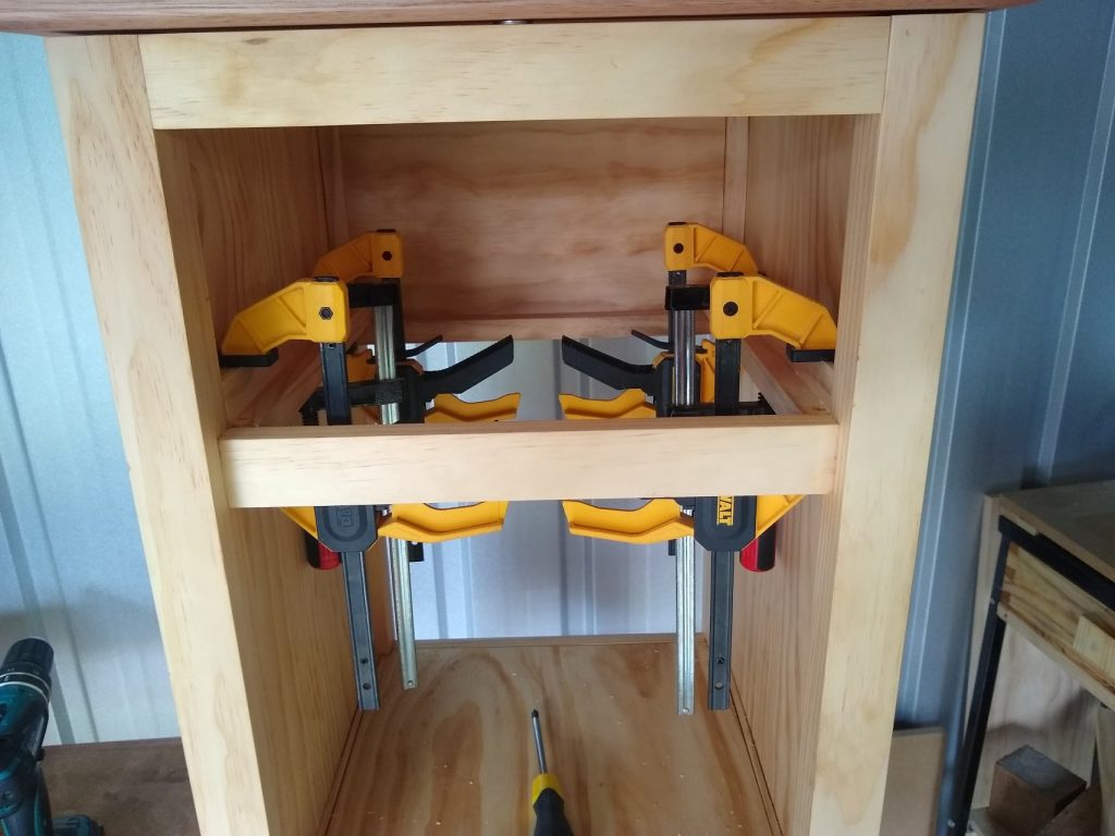 I made a simple frame for the drawer to slide on and attached it to the inside of the base